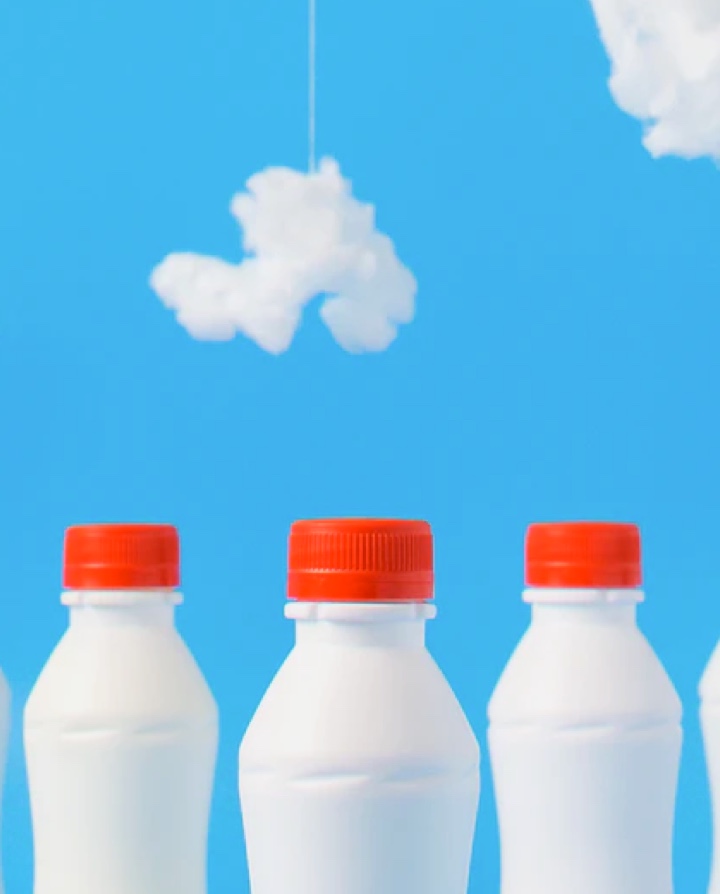 Four milk bottles in a row