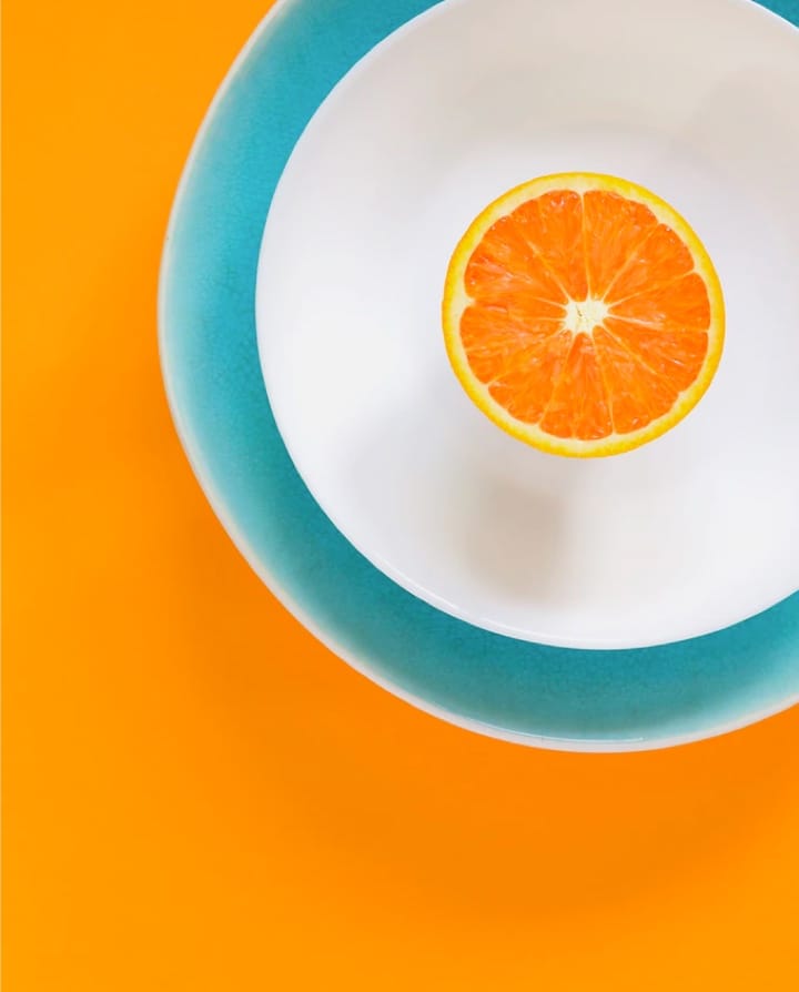 An orange slice on a bright background